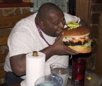 Fat guy eating burger